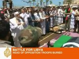 Libyan rebel commander buried amid questions