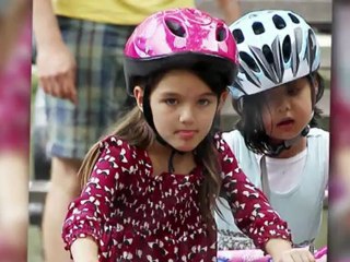 Suri Cruises on a Bike in New York City