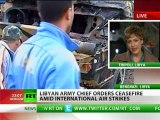 RT's Paula Slier reports live as anti-aircraft fire rains out over Tripoli