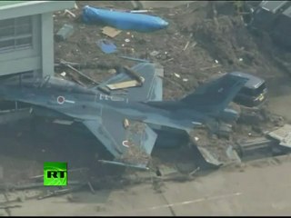 Video of fighter jets in mud after tsunami hits Japan Air Force base