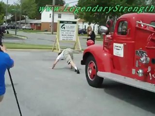 Strongman Picnic Pulling Fire Engine By Hair