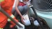 Young Chinese girl rescued after being trapped under bus