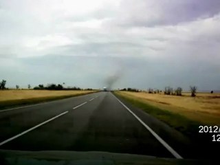Low pass jet Sukhoi Su-24 on highway in Russia.