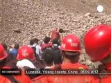 Survivors and rescuers flee landslides... - no comment