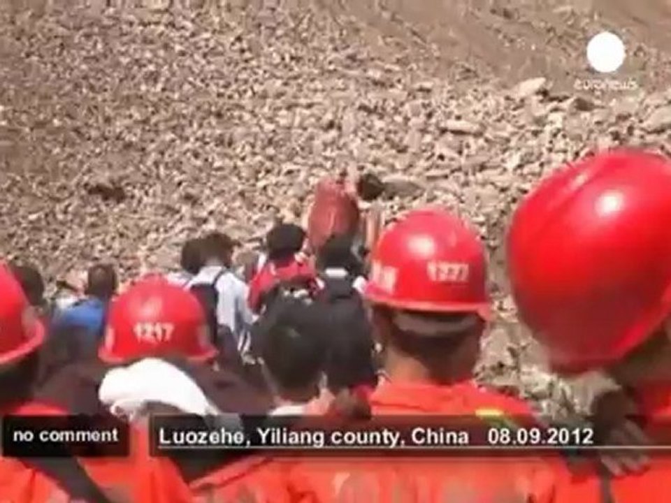 Survivors and rescuers flee landslides... - no comment