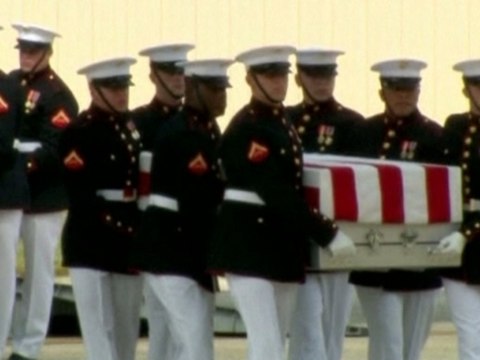 Obama vows to stand fast as caskets from Libya return