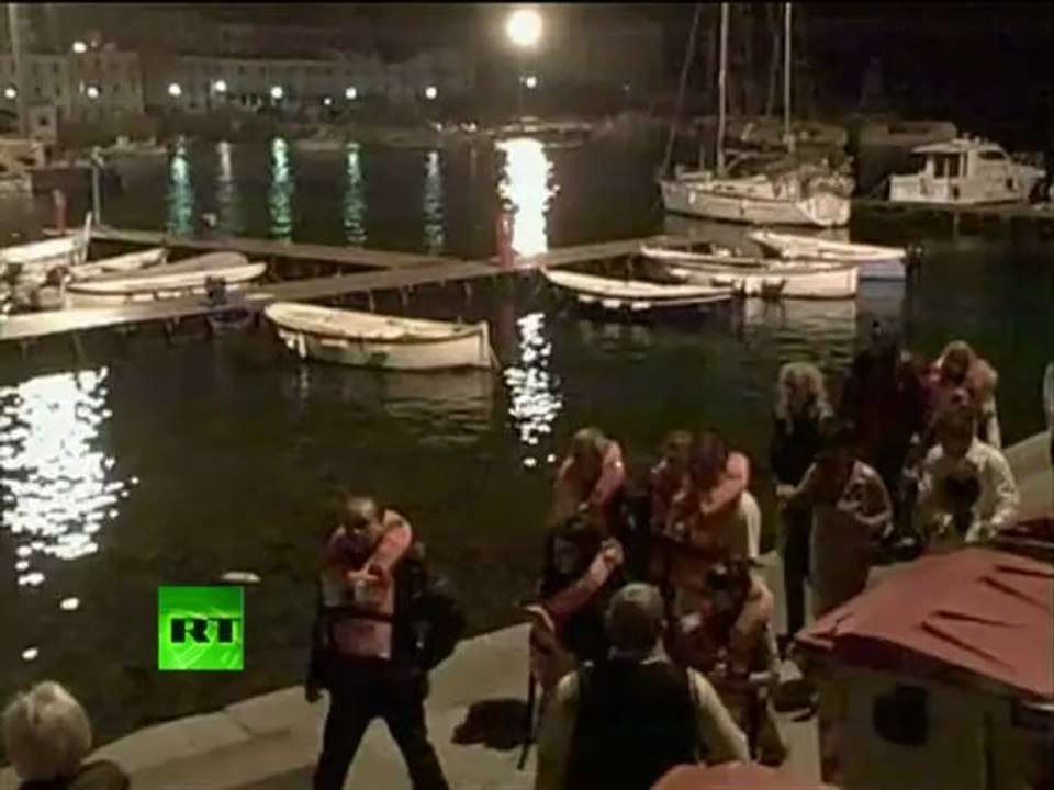 Amateur video: Shocked Costa Concordia passengers escape sinking liner
