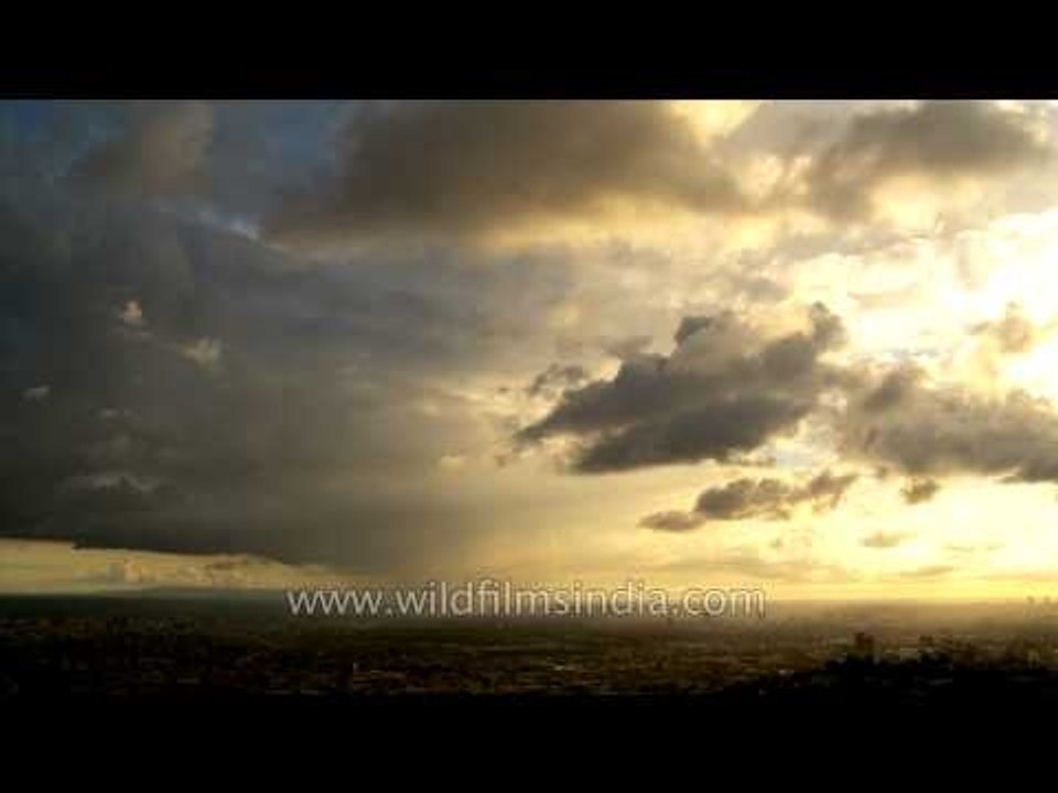 Time- lapse: Clouds in different colours running together