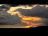 Time- lapse: Thick grey clouds covering the sun