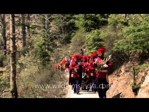 Army Band of Garhwal Rifles along the mountains of Garhwal, accompanying idol of Mother Ganga