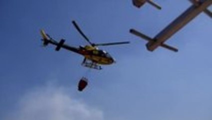 Firefighting Helicopter Fills Up At Pool