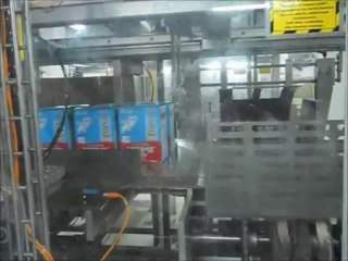 Wrap around case packing of cartons with infant food pouch