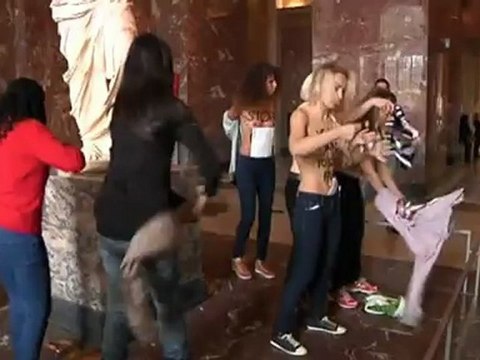 Topless protest in Paris: Femen demonstrate at the Louvre