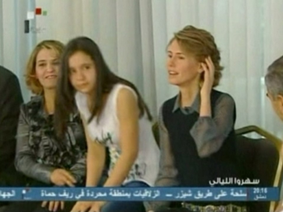 Syrian first lady Asma al-Assad meets students in Damascus.