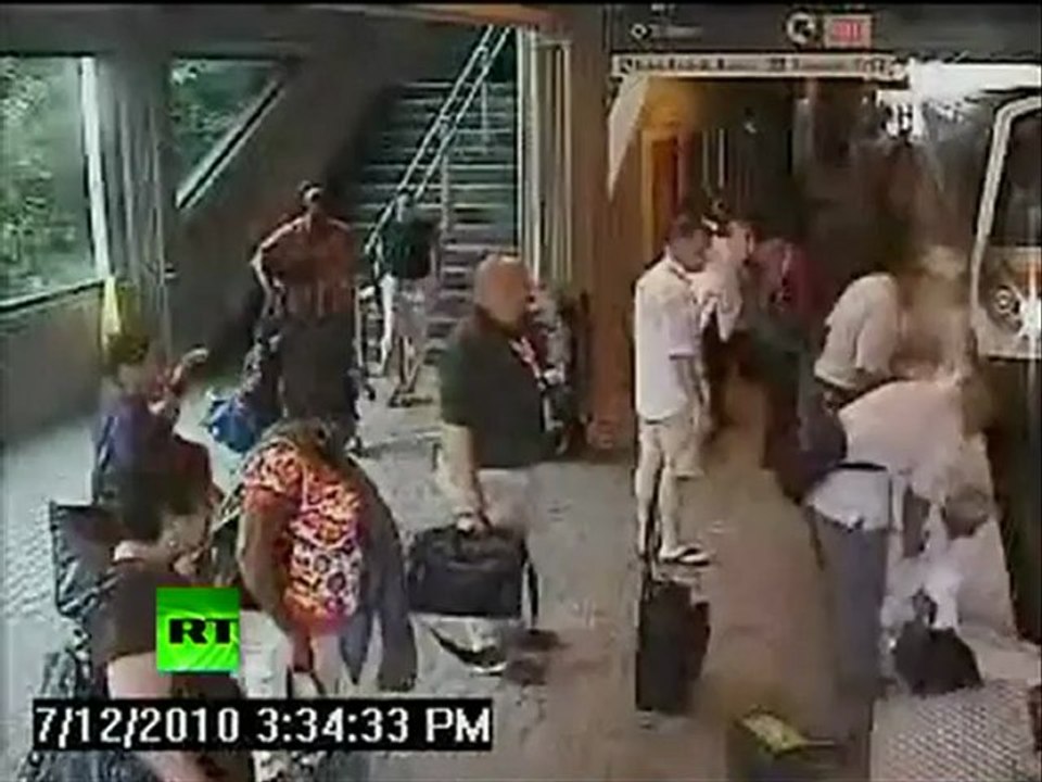 Dramatic CCTV shows woman on tracks, train stops feet away