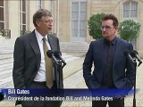 Bono et Bill Gates saluent 