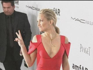 Kate Hudson steals the show in low cut red dress
