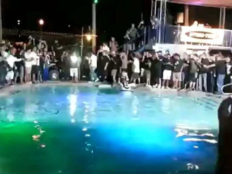 Jet ski doing awesome back flips in a swimming pool