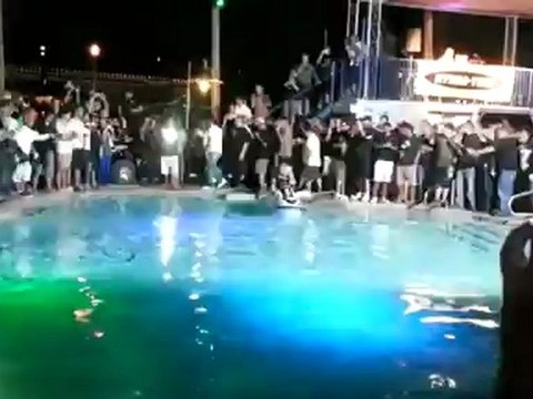 Jet ski doing awesome back flips in a swimming pool