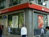 Santander profit plunges on property losses