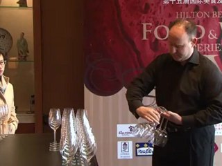 World record sees 45 glasses in one hand