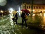 Visitors walk in the flooded St. Mark square in Venice