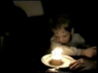 Dog blows out birthday candle