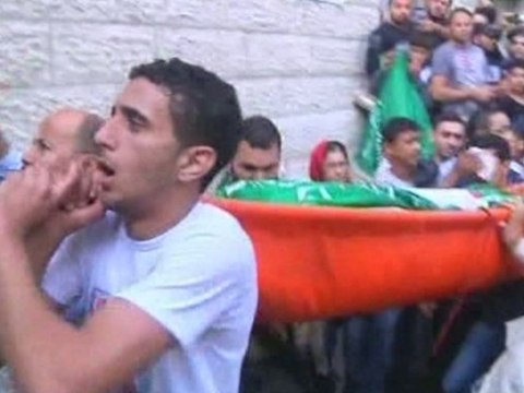 Gazans mourn dead as Israelis praise 'Iron Dome'