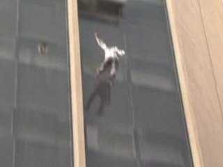 Man falls to his death after clinging to 10th floor window of burning building