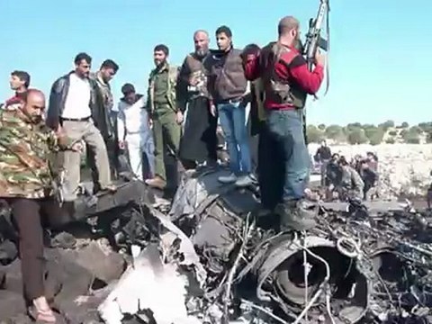 Syrian rebels celebrate after shooting down warplane