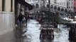 Tourists brave floods in Venice