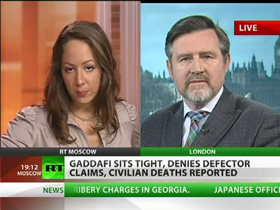 Libya Conflict: Gaddafi sits tight, denies defector claims