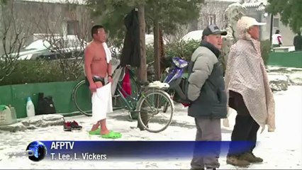 Chinese ice swimmers plunge into freezing waters