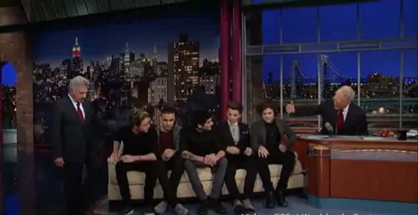 Dustin Hoffman smooches Niall Horan as One Direction appear on Letterman.