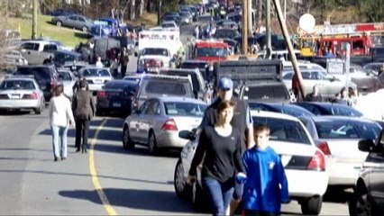 Shock surrounds Newtown after school massacre