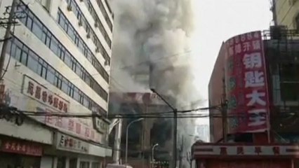 Hundreds evacuated after huge building fire in China