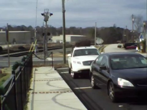 Norfolk Southern tank train with 2 covered hoppers northwest through Austell Ga.
