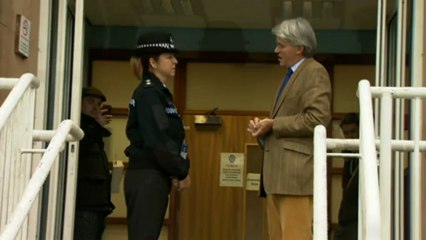 Andrew Mitchell kisses police officer after visit
