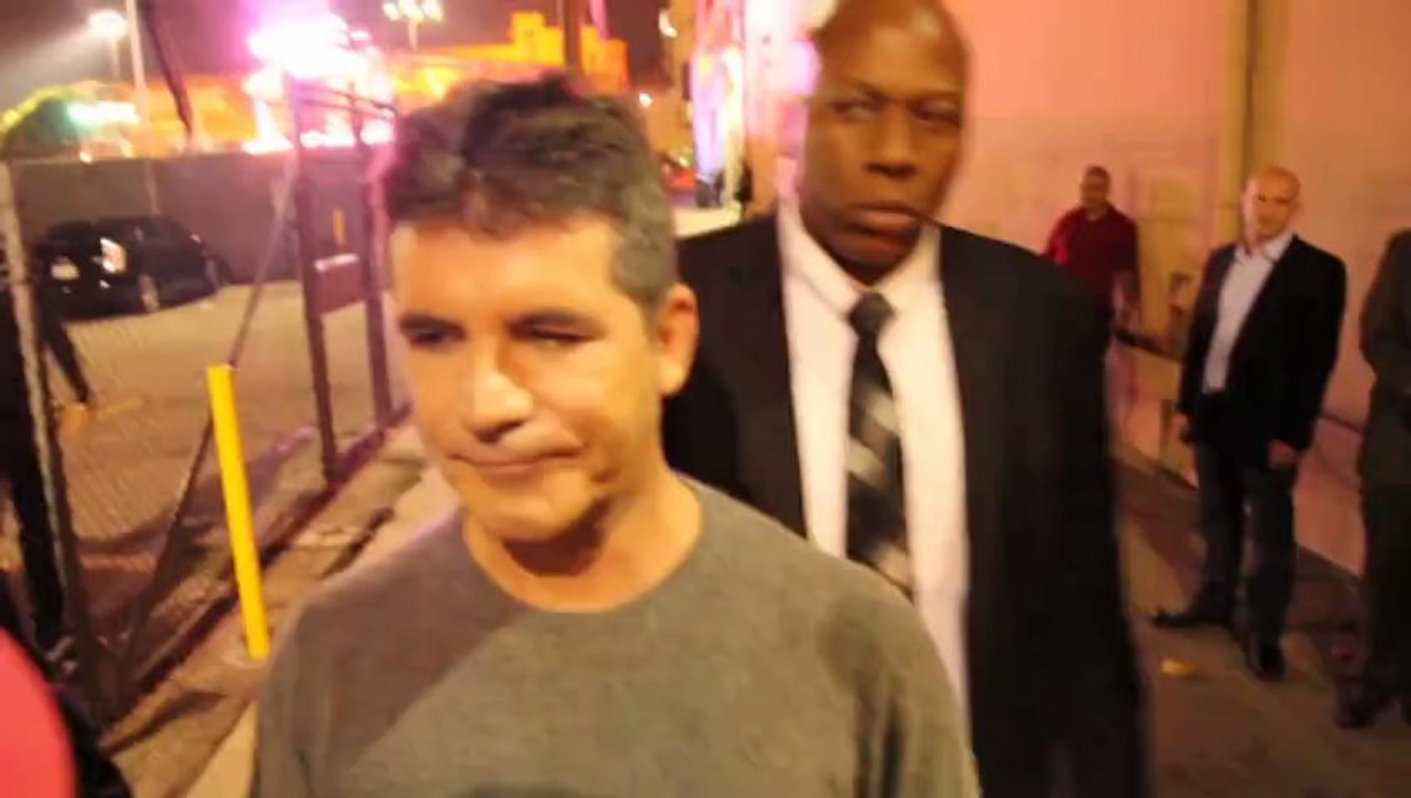 Simon Cowell Admits He's 'Dating' Carmen Electra