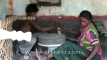 2617.Woman grinding grain with a hand mill at Nana village.mov