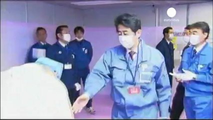 Japan PM visits Fukushima as government pledges nuclear...