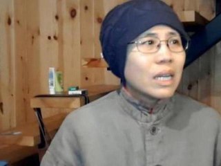 Wife of Chinese dissident under house arrest