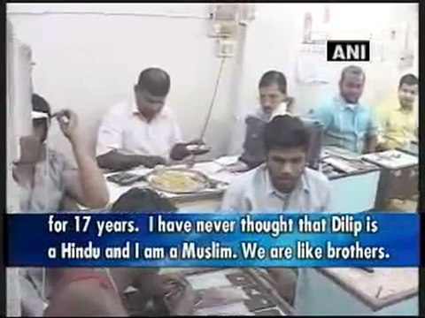 Displaying brotherhood, Hindu, Muslim run a business together.mp4