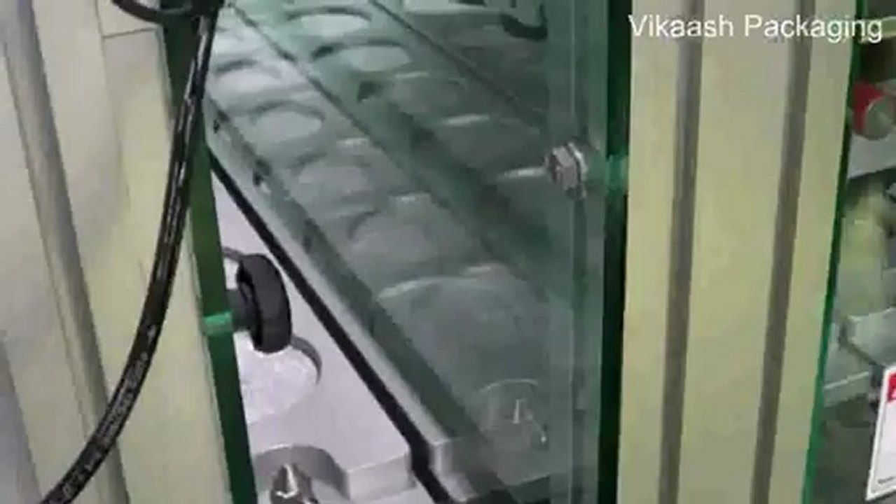 Linear type cup filling , sealing and capping machine with pre cut aluminium foil option. finished