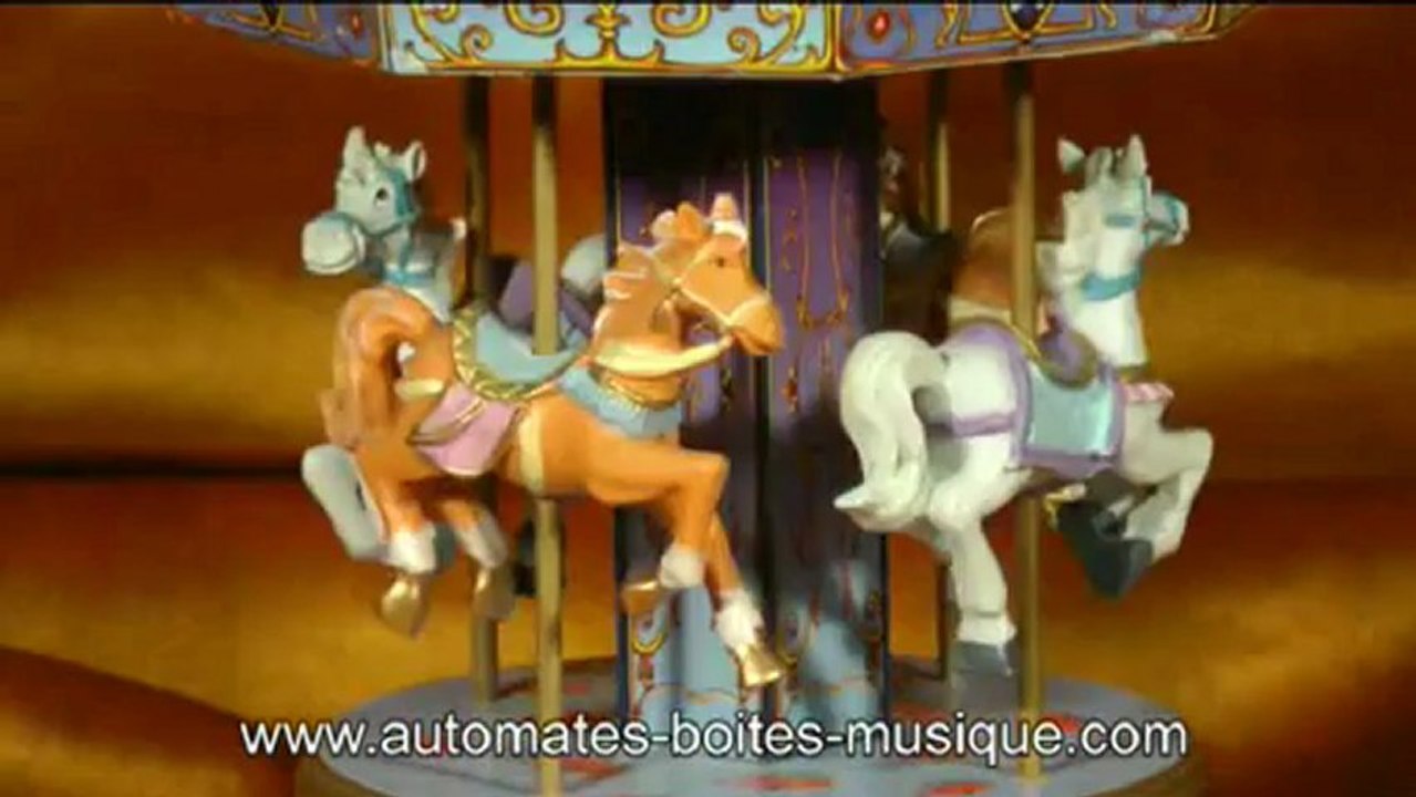 Lutèce Créations, spécialiste des boîtes à musique et des automates présente un carrousel musical miniature de sa collection de manèges musicaux animés (carrousels, grandes roues et autres manèges miniatures).