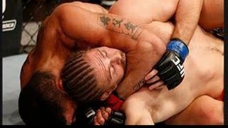 Ronny Markes attempts a rear choke submission against Andrew Craig in their middleweight fight at the UFC on FX