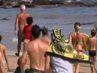 Man pushes shark back into sea in Australia