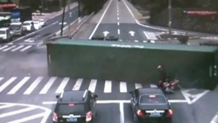 Motorcyclist narrowly escapes death as truck overturns