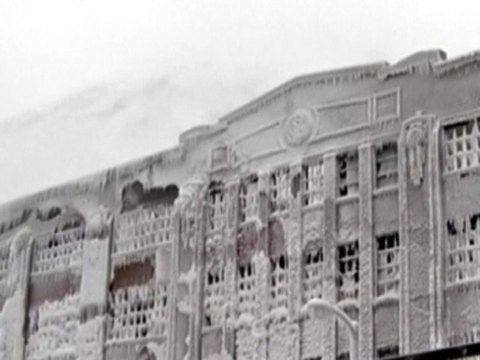 Burning warehouse takes on appearance of an ice sculputre, after firefighters douse the flames