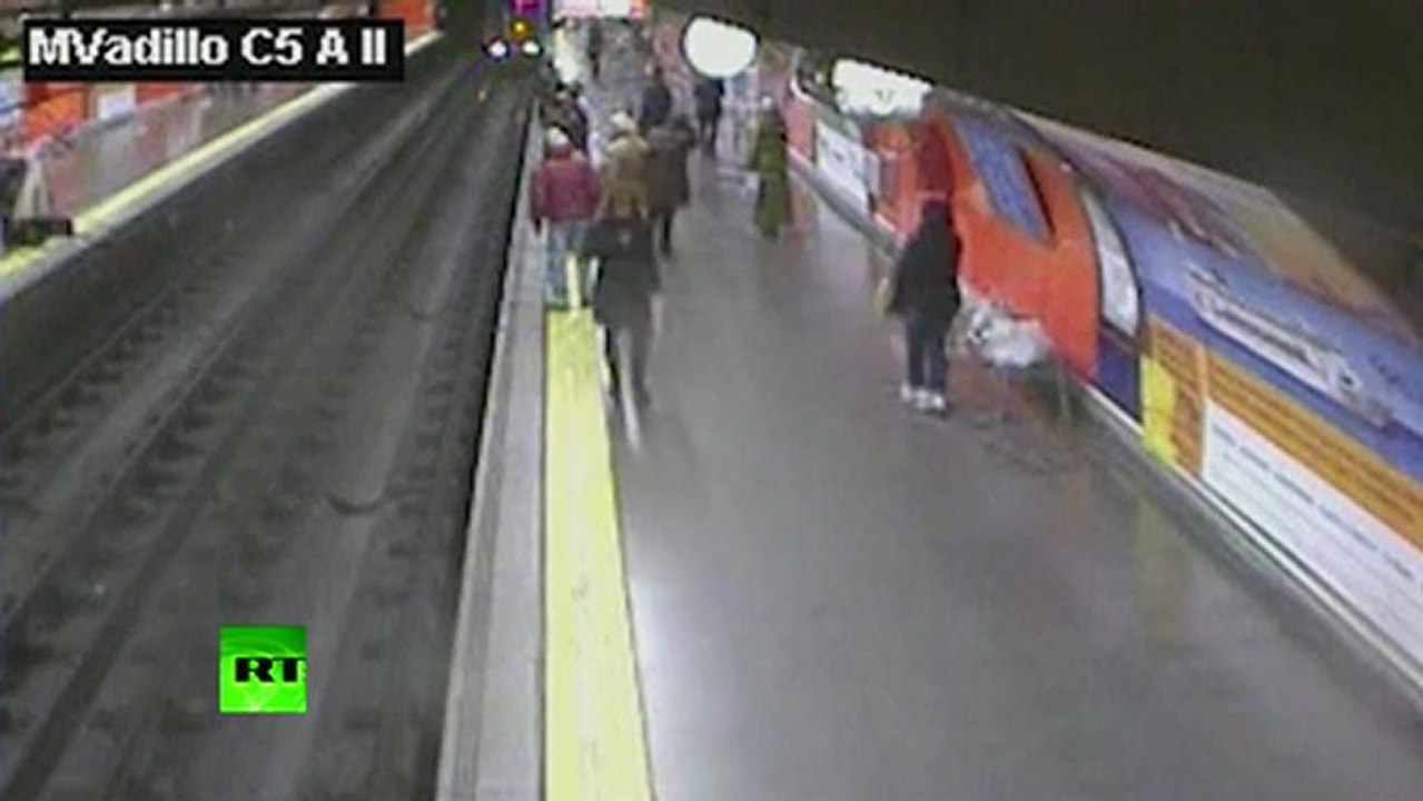 CCTV: Cop saves woman after she falls on tracks in Madrid Metro